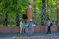 June 7, 2015 St. Petersburg, Russia. A street photographer with an assistant takes pictures of a couple in love