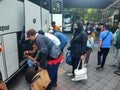 June 9, 2023. Bawen, Cenral Java, Semarang. Indonesia. People are preparing to store the bagages in the bus. Royalty Free Stock Photo