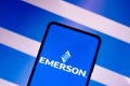 June 7, 2022, Brazil. In this photo illustration, the Emerson Electric logo is displayed on a smartphone screen and in the