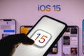 June 8, 2021, 2021, Brazil. In this photo illustration the iOS 15 logo is seen on a smartphone with an Apple logo in the