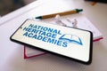 June 30, 2022, Brazil. In this photo illustration the National Heritage Academies logo seen displayed on a smartphone next to a