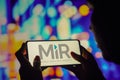 June 7, 2022, Brazil. In this photo illustration, a silhouetted woman holds a smartphone with the Mobile Industrial Robots MIR