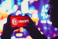 June 1, 2022, Brazil. In this photo illustration, a silhouetted woman holds a smartphone with the Ubisoft Entertainment logo Royalty Free Stock Photo