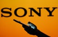 June 13, 2023, Brazil. Sony logo seen in the background of a silhouette woman holding a mobile