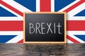 June 23: Brexit UK EU referendum concept with flag and handwriting text written in chalkboard on black Royalty Free Stock Photo