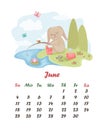 June. Calendar 2023. Cute rabbit on a fishing trip. The image of a rabbit who fell asleep with a fishing rod in his hand