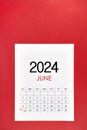 June 2024 calendar page with push pin on red