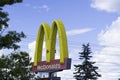 24 June 2019 - Calgary, Alberta Canada - Macdonalds Arch in front of A Restaurant