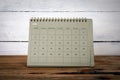 JUNE 2024 cardboard desk calendar and planner on a wooden texture table