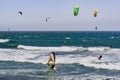 June 6, 2019 Davenport / CA / USA - People kite and wind surfing in the Pacific Ocean, near Santa Cruz, on a sunny and warm day