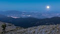 From a high mountain in the Murcia region a view of the coast under a full moon.