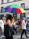 Woman with rainbow umbrella at at LGBT gay pride