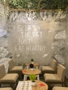June 26, 2020 - Jakarta : A gray concrete mural in a cafe, saying Skip The Diet Just Eat Healthy