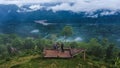 June 24, 2023 Mae Hong Son, Thailand - Group of young tourists taking photos by drone against the landscape of misty valley and