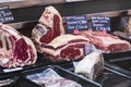 Showcases and shelves of the Wagner Market in Milan with many with assortment of cheeses, meat, vegetables and seafood