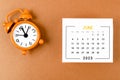 The June 2023 Monthly calendar for the organizer to plan 2023 year with alarm clock on yellow background