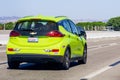 June 30, 2019 Mountain View / CA / USA - Chevrolet Bolt EV in the Green Mist Metallic colors driving on the freeway in South San