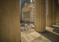 JUNE 7, 2018 - New York, New York, USA - New York Stock Exchange Exerior with US Flags - as seen through columns of Federal Hall Royalty Free Stock Photo