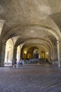 June 2022 Parma, Italy: Entrance and stairs of the Palace Palazzo Pilotta across the arches, columns, and visitors
