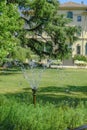 June 2021 Parma, Italy: Fondation Magnani Rocca. Beautiful building of museum across garden and fountain with bubbling water Royalty Free Stock Photo