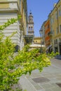 June 2021 Parma, Italy: Old town, city street, colorful buildings, bell tower of church of Chiesa di San Sepolcro. Travel destinat