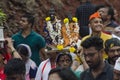 28 June 2019, Portrait of a varkari Lady with Vitthala idol. dnyaneshwar palkhi pilgrimage - a woman carrying deity idols on her