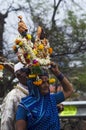 28 June 2019, Portrait of a varkari Lady with Vitthala idol. dnyaneshwar palkhi pilgrimage - a woman carrying deity idols on her