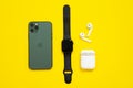 June 05, 2020, Rostov, Russia: Mobile phone iPhone 11 Pro of midnight green color, wireless headphones AirPods with an open case