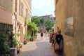 June 02 2023 - Saint-Florent, Corsica, France: people in the inner city with coloured houses