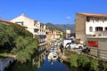 June 02 2023 - Saint-Florent, Corsica, France: people in the inner city with coloured houses