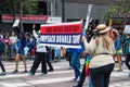 June 30, 2019 San Francisco / CA / USA - Participants at the 2019 San Francisco Pride Parade carrying a sign with a political