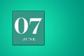 June 7 is the seventh day of the month. calendar date framed on a green background