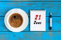 June 21st. Image of june 21 , daily calendar on blue background with morning coffee cup. Summer day, Top view