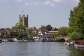 St Mary\'s Church of England tower overlooking the Thames with its boats and barge