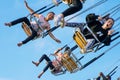 Teenagers ride swing chairs at Hastings fun fair Royalty Free Stock Photo