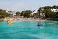 June 16th, 2017, Cala D`or, Mallorca, Spain - view of the beach with people in the water