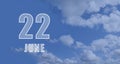 June 22. 22th day of the month, calendar date.White numbers against a blue sky with clouds. Copy space, Summer month, day of the