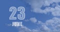 June 23. 23th day of the month, calendar date.White numbers against a blue sky with clouds. Copy space, Summer month, day of the