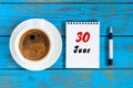 June 30th. Image of june 30 , daily calendar on blue background with morning coffee cup. Summer day, Top view