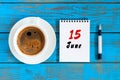 June 15th. Image of june 15 , daily calendar on blue background with morning coffee cup. Summer day, Top view
