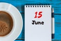 June 15th. Image of june 15 , calendar on blue background with morning coffee cup. Summer day, Top view