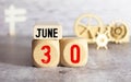 June 30th.June 30 white wooden calendar on vintage wood abstract background. Summer day