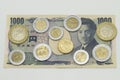 Japanese Yen and Mexican Peso coins