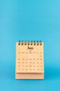 June 2024 white desk calendar on blue color