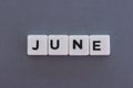 June word made of square letter word on grey background Royalty Free Stock Photo