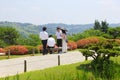 June 2018, Young Asian men woman parasol Japanese Kenrokuen gardens, Kanazawa, Japan Royalty Free Stock Photo