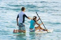 June 2012 - A young couple is surfing pacific ocean waikiki beach hawaii united states