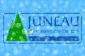 Juneau, Alaska winter snowflakes flag background. United States of America