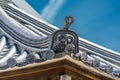 Junen-ji Temple, Onigawara (Ogre Tile) roof detail at Daibustuden hall. Nagano City, Japan