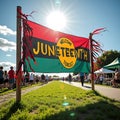 Juneteenth celebration banner in park with community festival atmosphere Royalty Free Stock Photo